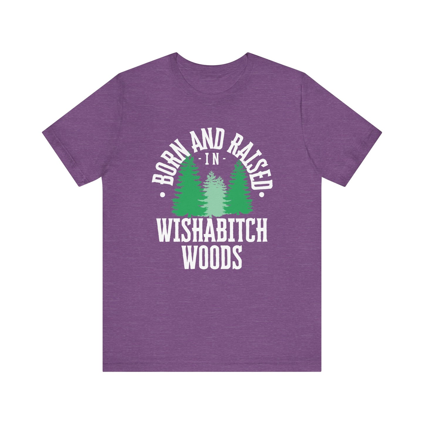 Comfortable adult humor tee stating Born and Raised in Wishab*tch Woods in color purple heather