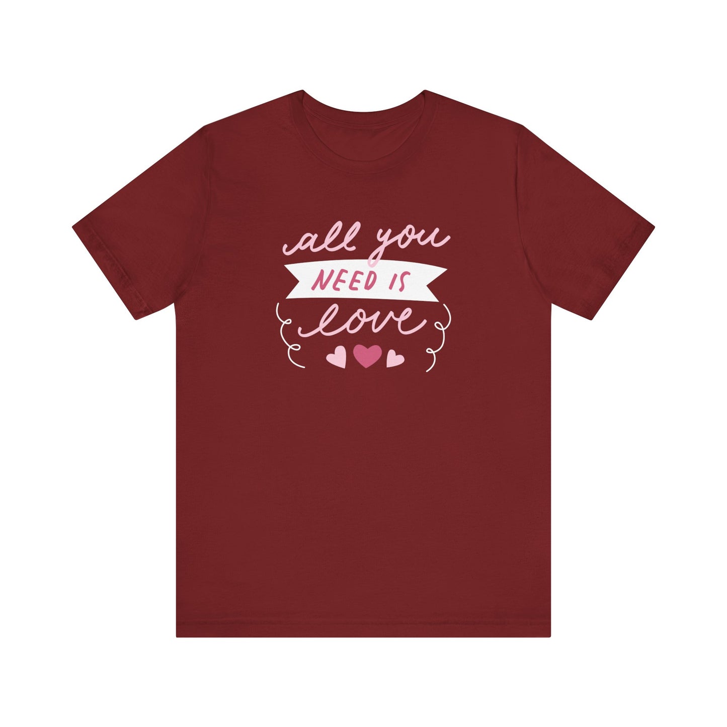 Comfortable Women's Graphic Tee Stating 'All You Need Is Love' in color maroon