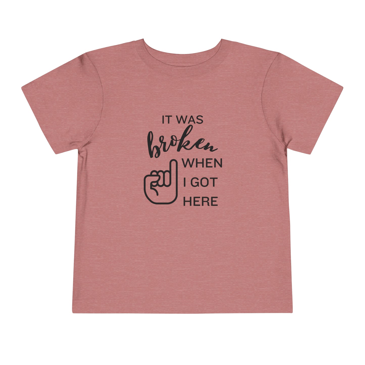 Comfortable funny graphic toddler tee stating 'It was broken when I got here' in color heather mauve