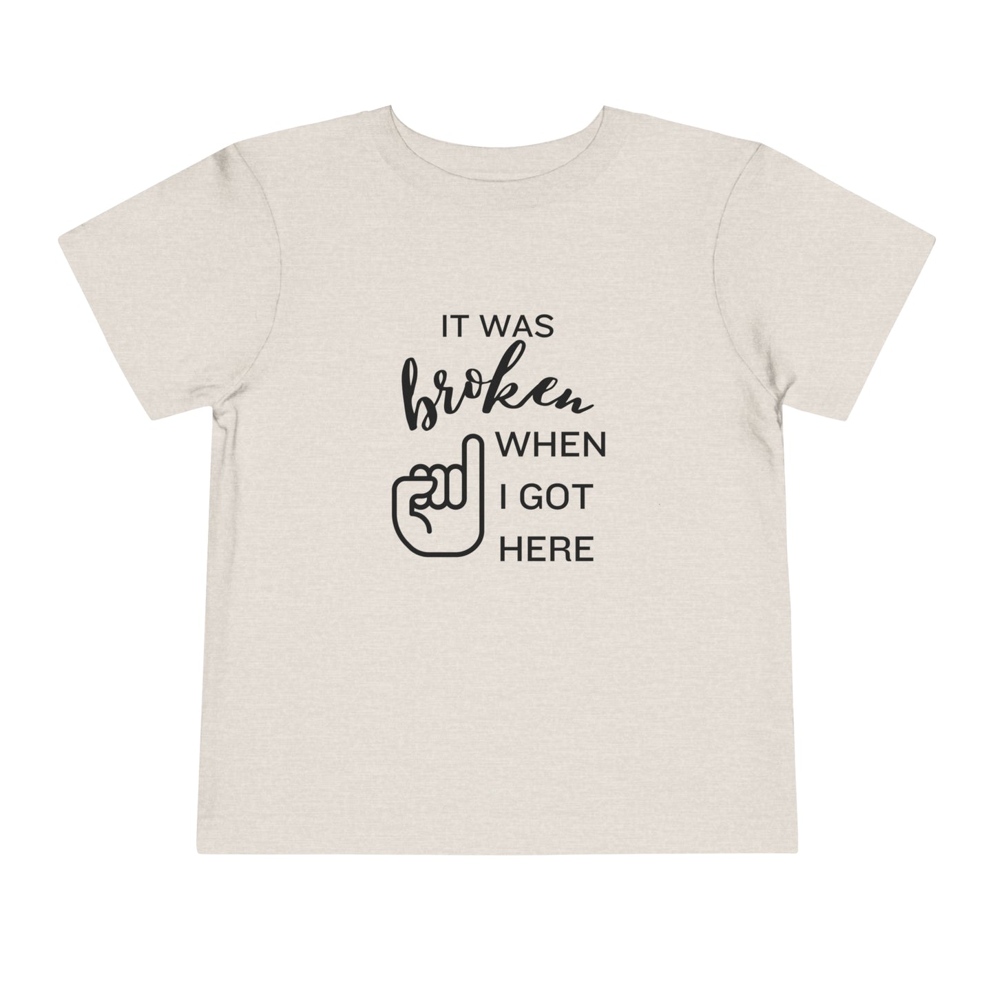 Comfortable funny graphic toddler tee stating 'It was broken when I got here' in color dust heather