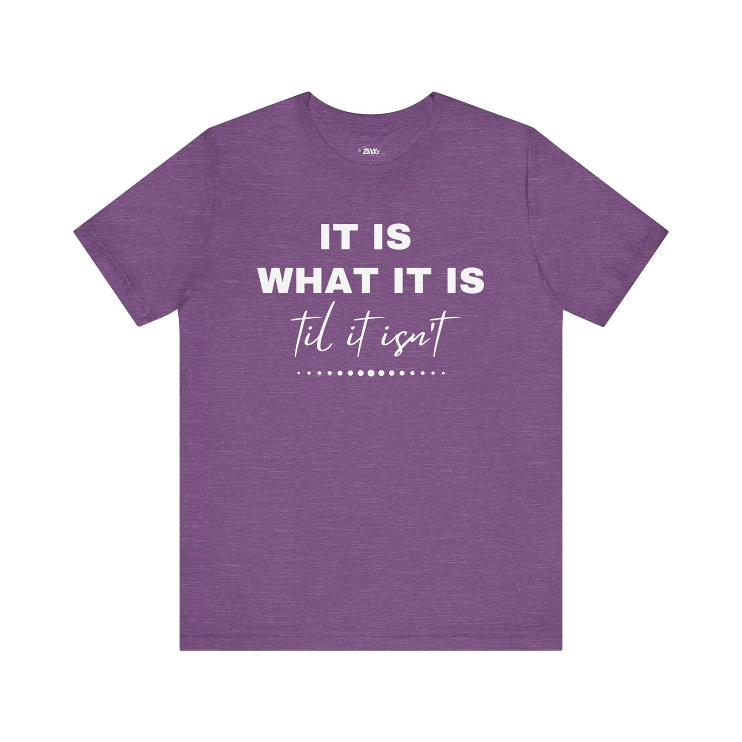Funny graphic tee stating It Is What It Is, Til It Isn't in color purple heather