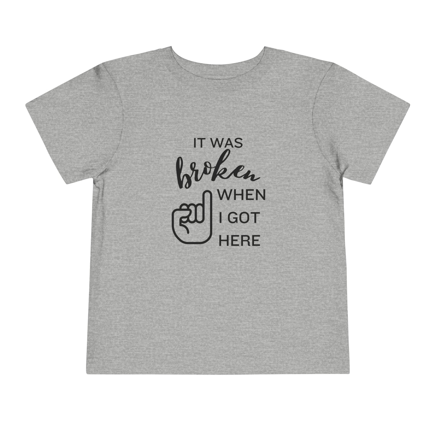 Comfortable funny graphic toddler tee stating 'It was broken when I got here' in color athletic heather
