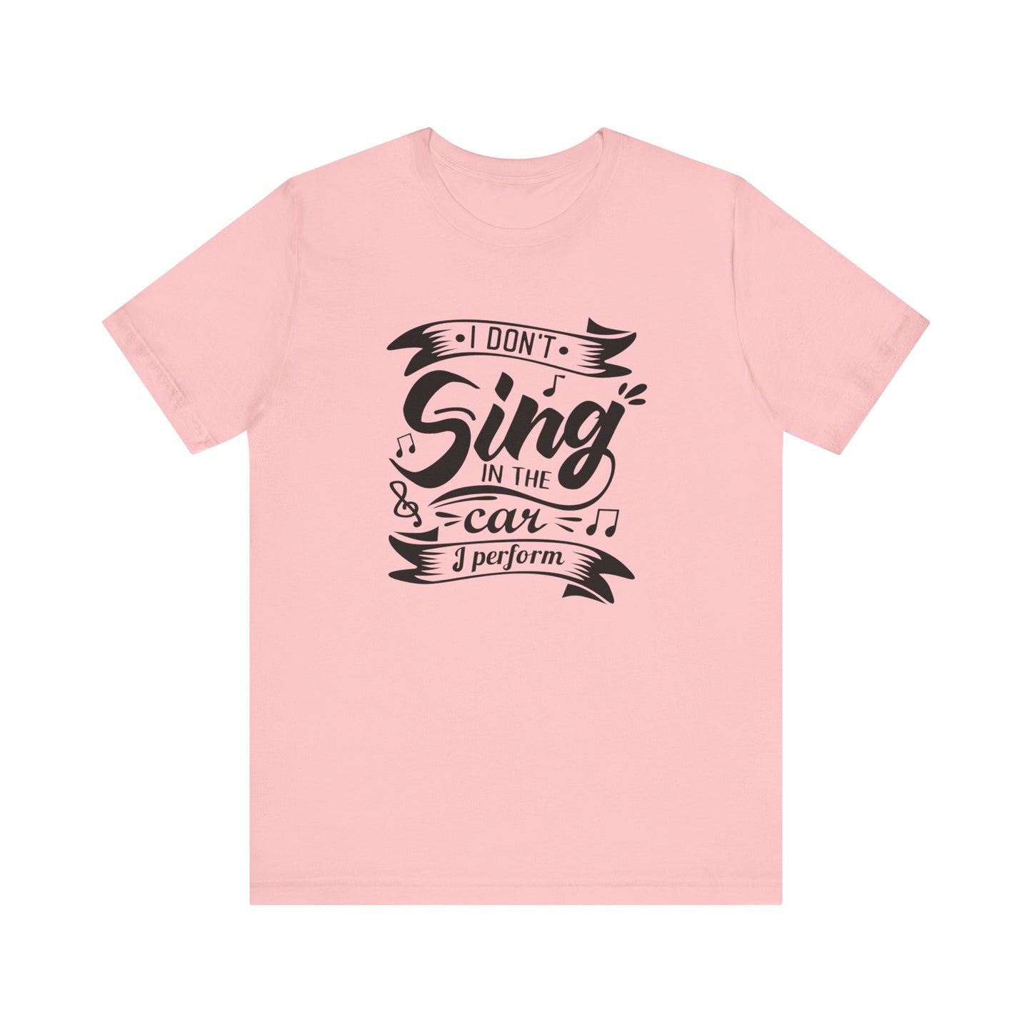 Graphic tee stating 'I Don't Sing in the Car, I perform' in color pink