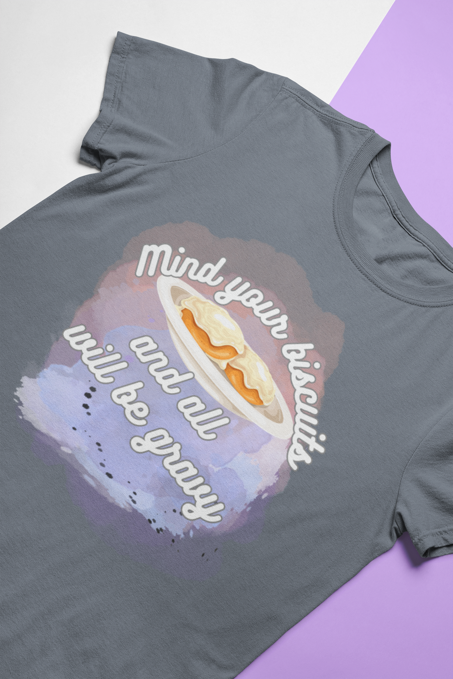 A comfortable funny southern graphic tee stating Mind You Biscuits and All will be Gravy in color asphalt