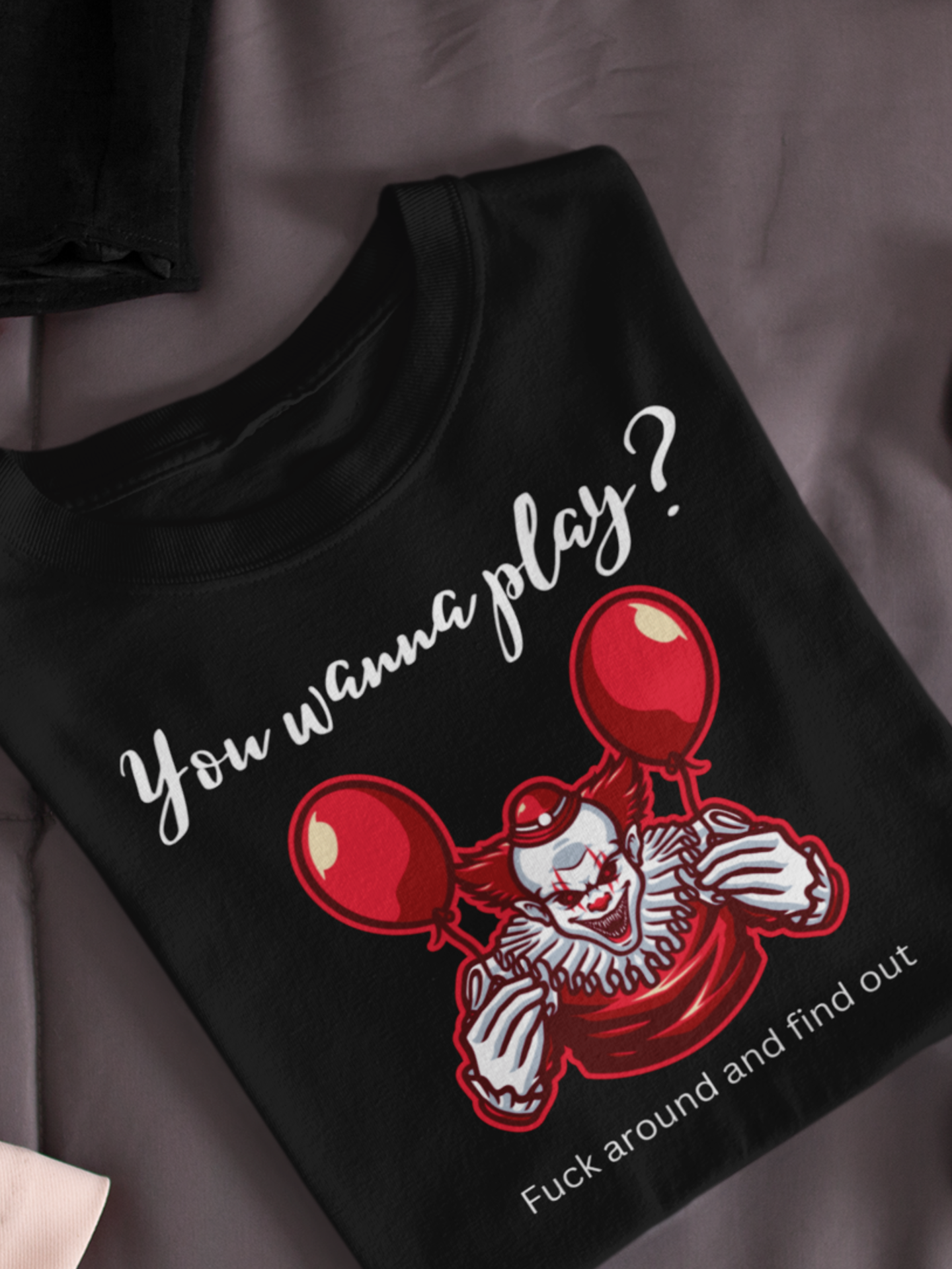 Unisex Halloween Tee stating 'You wanna play? Fuck around and find out.' with Pennywise in color black.