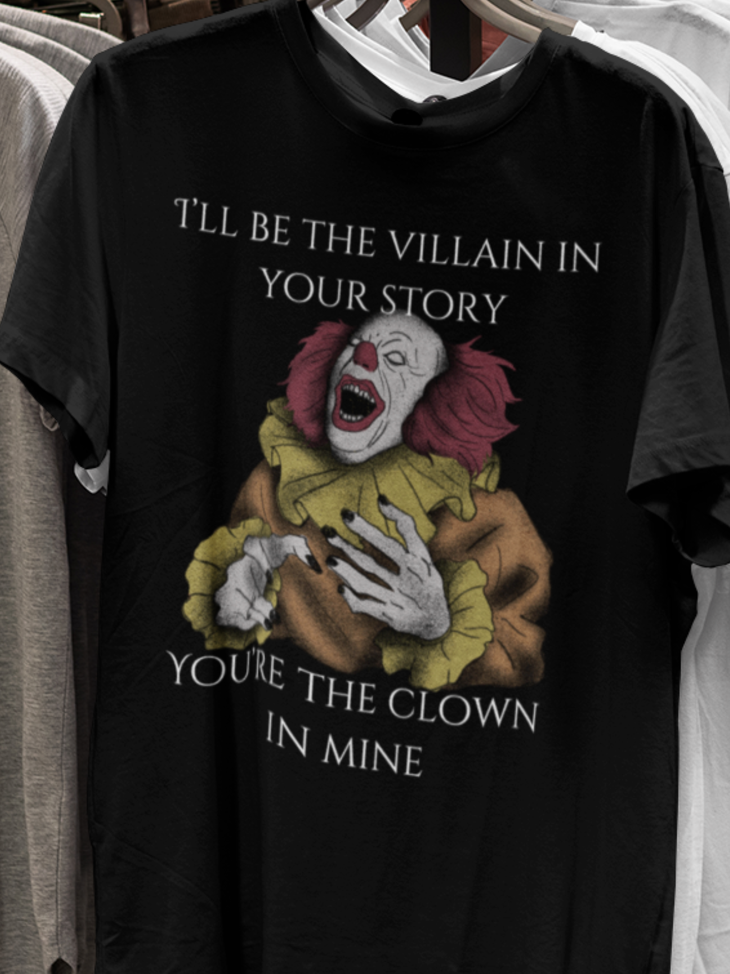 Comfortable Halloween tee with Pennywise that says 'I'll be the villain in your story. You're the clown in mine.' in color black