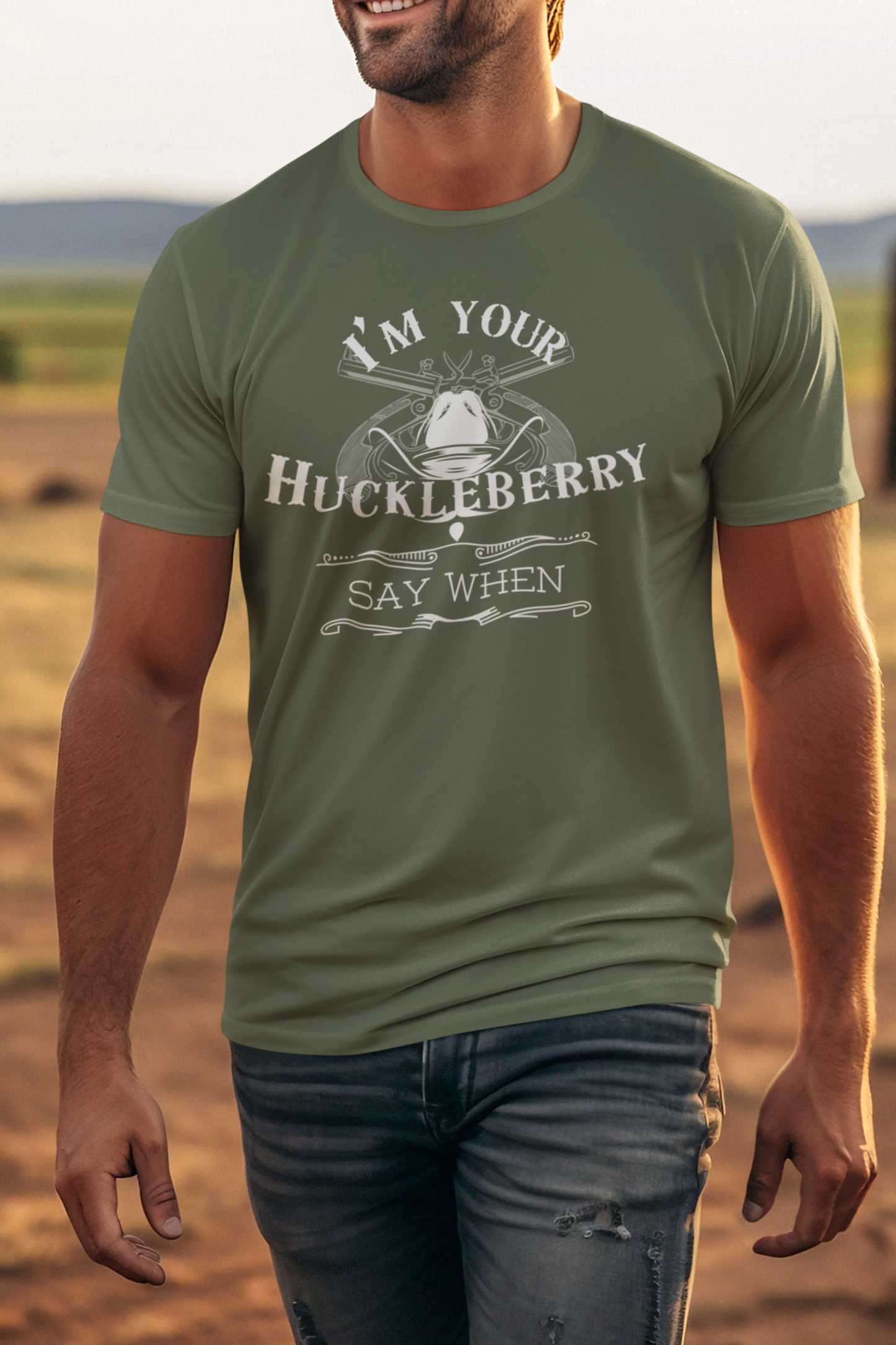 Man wearing comfortable graphic tee stating I'm Your Huckleberry - Say When in color Military Green