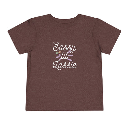 Comfortable funny graphic toddler tee stating 'Sassy Lil Lassie' in color  maroon heather