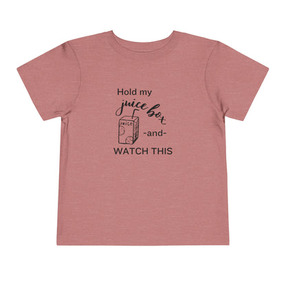 Comfortable funny graphic toddler tee stating 'Hold my juice box and watch this' in color heather mauve