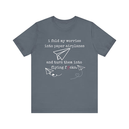 Women's adult humor t-shirt stating 'i fold my worries into paper airplanes and turn them into flying fucks' in color steel blue