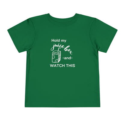 Comfortable funny graphic toddler tee stating 'Hold my juice box and watch this' in color kelly