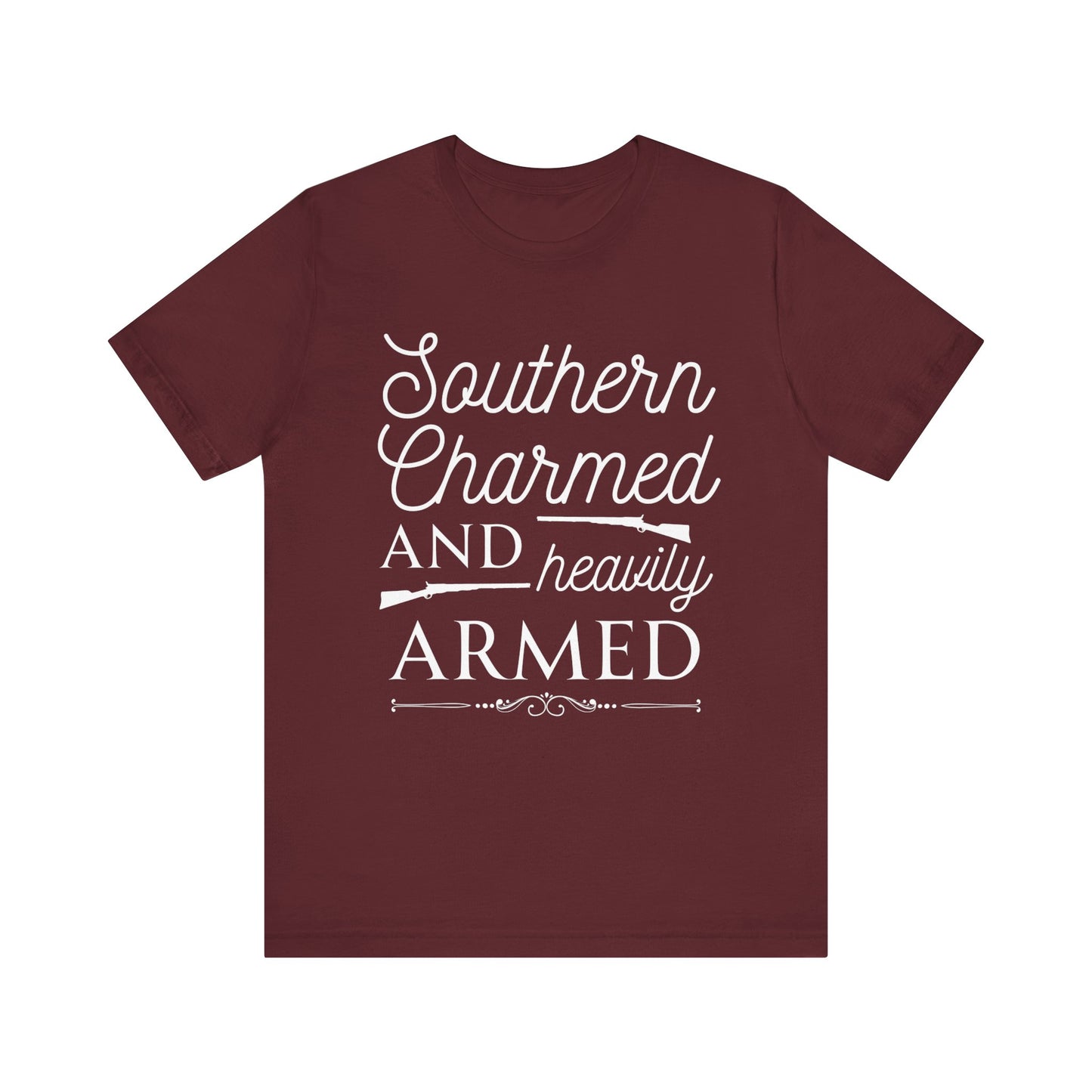 Adult unisex t-shirt stating 'Southern Charmed and Heavily Armed' in color maroon
