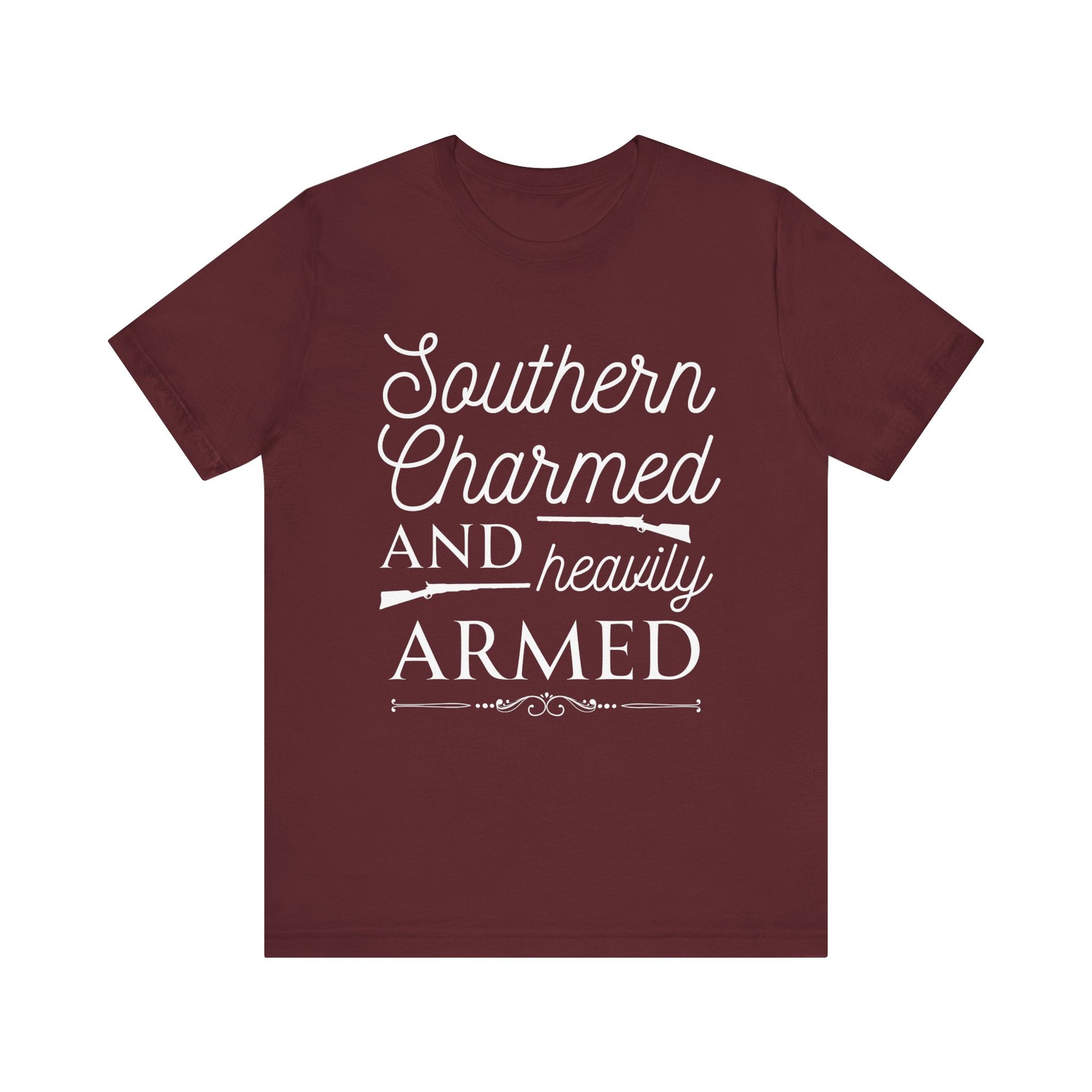 Adult unisex t-shirt stating 'Southern Charmed and Heavily Armed' in color maroon