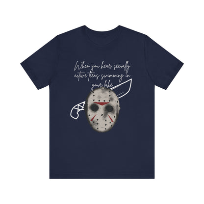 Unisex Comfortable Halloween tee with Jason mask that says 'When you hear sexually active teens swimming in your lake' in color navy