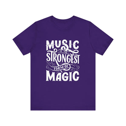 A comfortable good vibes tee stating 'Music is the strongest form of magic' in color purple