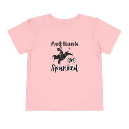 Comfortable Southern Toddler Tee stating 'Act Rank Get Spanked' in color pink