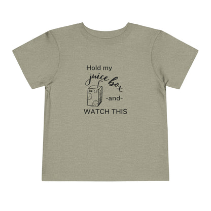 Comfortable funny graphic toddler tee stating 'Hold my juice box and watch this' in color heather stone