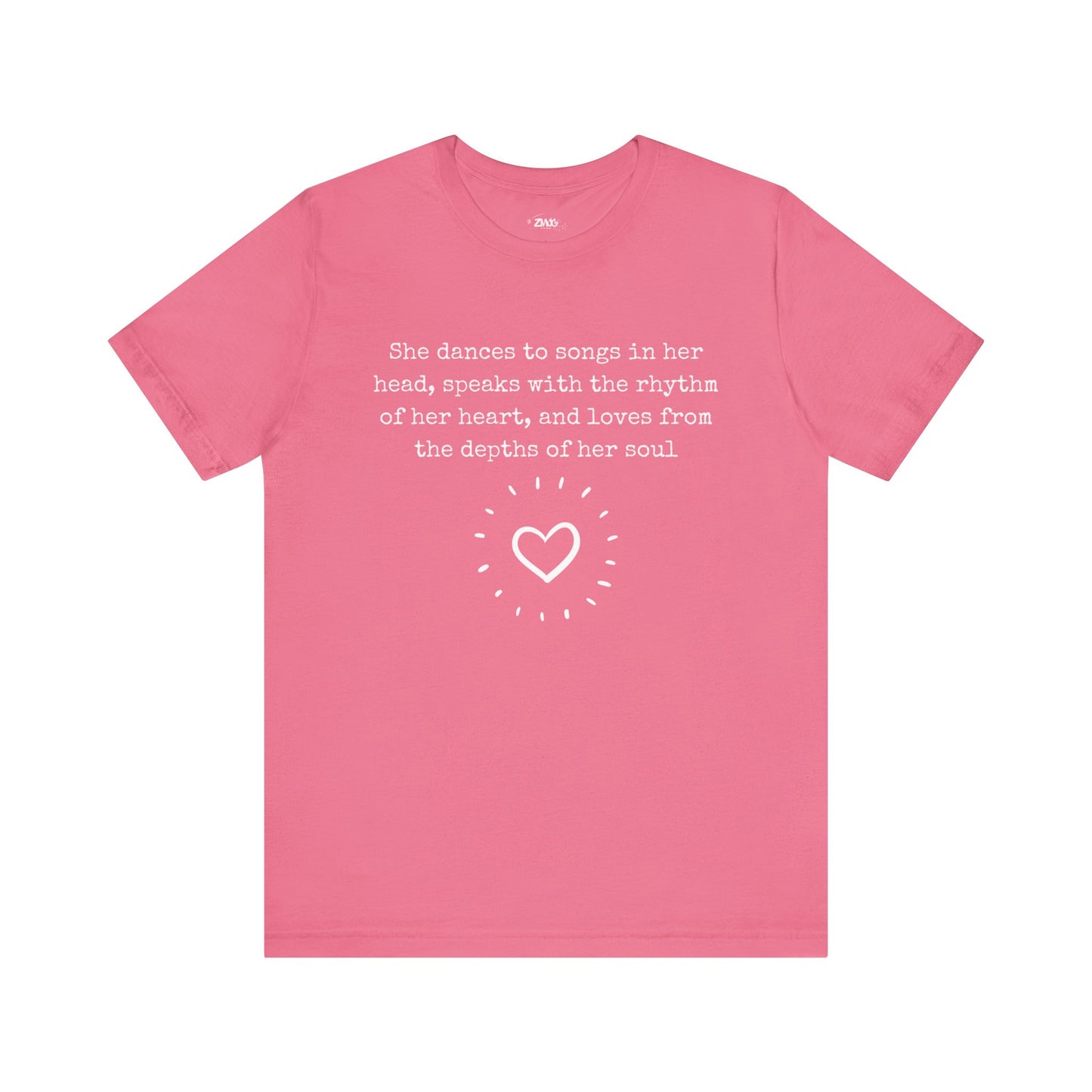 Comfortable good vibes graphic t-shirt stating 'She dances to songs in her head, speaks with the rhythm of her heart, and loves from the depths of her soul' in color charity pink