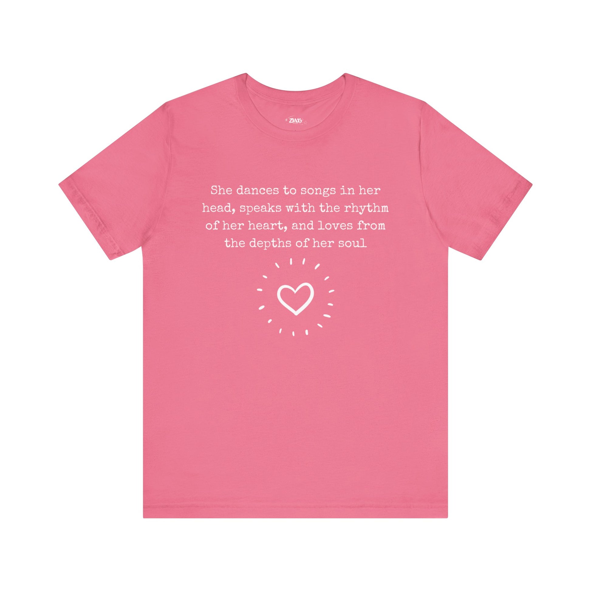 Comfortable good vibes graphic t-shirt stating 'She dances to songs in her head, speaks with the rhythm of her heart, and loves from the depths of her soul' in color charity pink