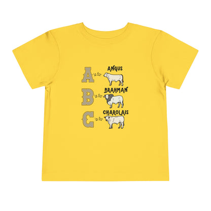 Comfy southern toddler tee stating 'A is for Angus. B is for Brahman. C is for Charolais.' in color yellow