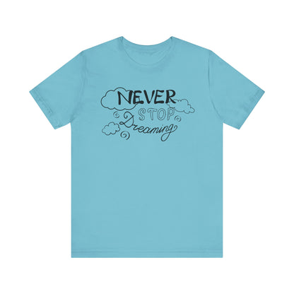 Good vibes women's tee stating 'Never Stop Dreaming' in color turquoise