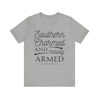 Adult unisex t-shirt stating 'Southern Charmed and Heavily Armed' in color athletic heather