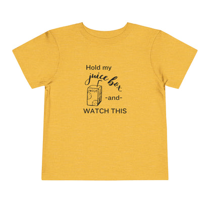 Comfortable funny graphic toddler tee stating 'Hold my juice box and watch this' in color heather golden yellow