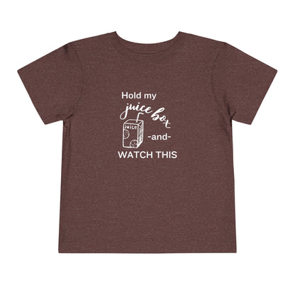 Comfortable funny graphic toddler tee stating 'Hold my juice box and watch this' in color heather maroon