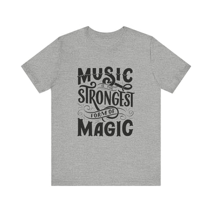 A comfortable good vibes tee stating 'Music is the strongest form of magic' in color athletic heather