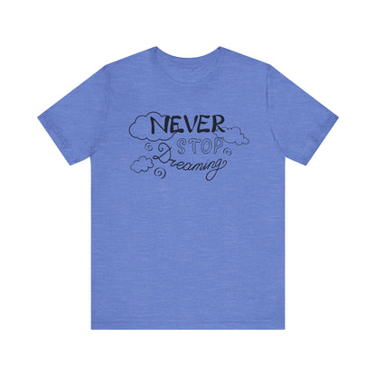 Good vibes women's tee stating 'Never Stop Dreaming' in color heather columbia blue