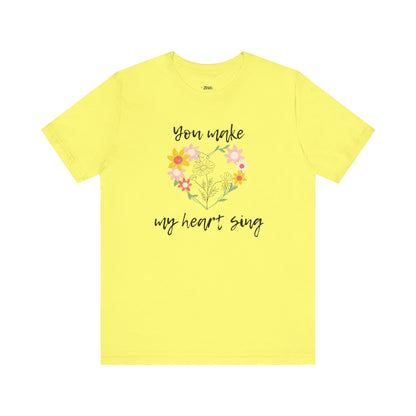 Adult graphic tee stating 'You Make My Heart Sing' in color yellow