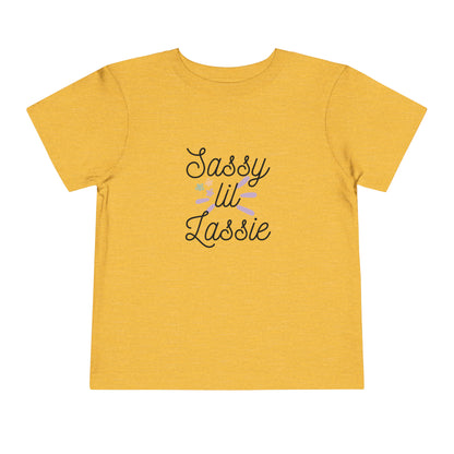 Comfortable funny graphic toddler tee stating 'Sassy Lil Lassie' in color  golden yellow heather