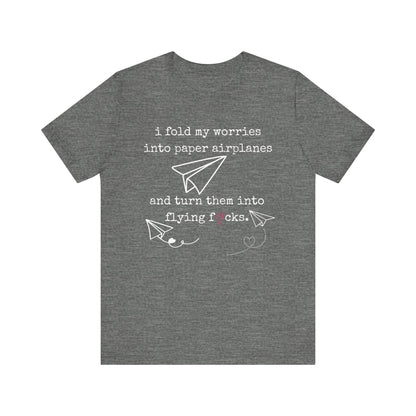 Women's adult humor t-shirt stating 'i fold my worries into paper airplanes and turn them into flying fucks' in color deep heather