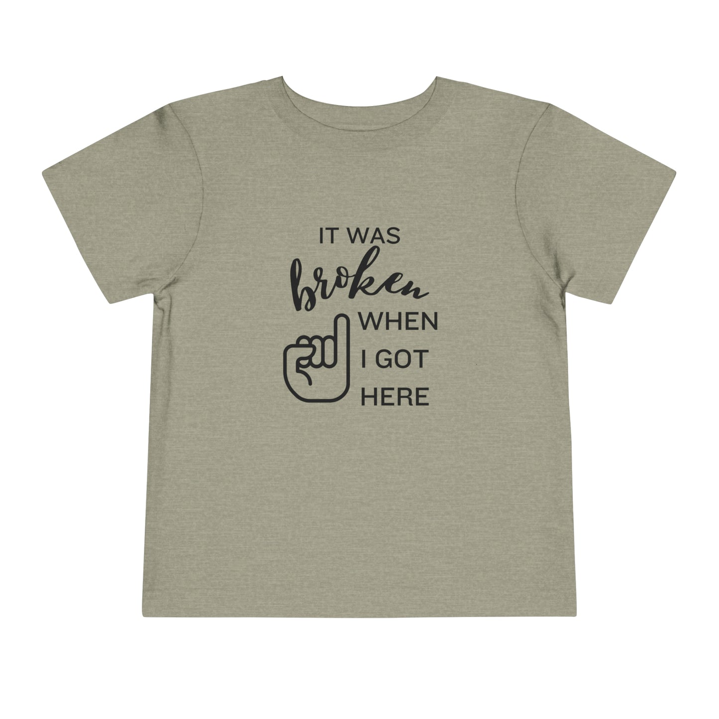 Comfortable funny graphic toddler tee stating 'It was broken when I got here' in color stone heather