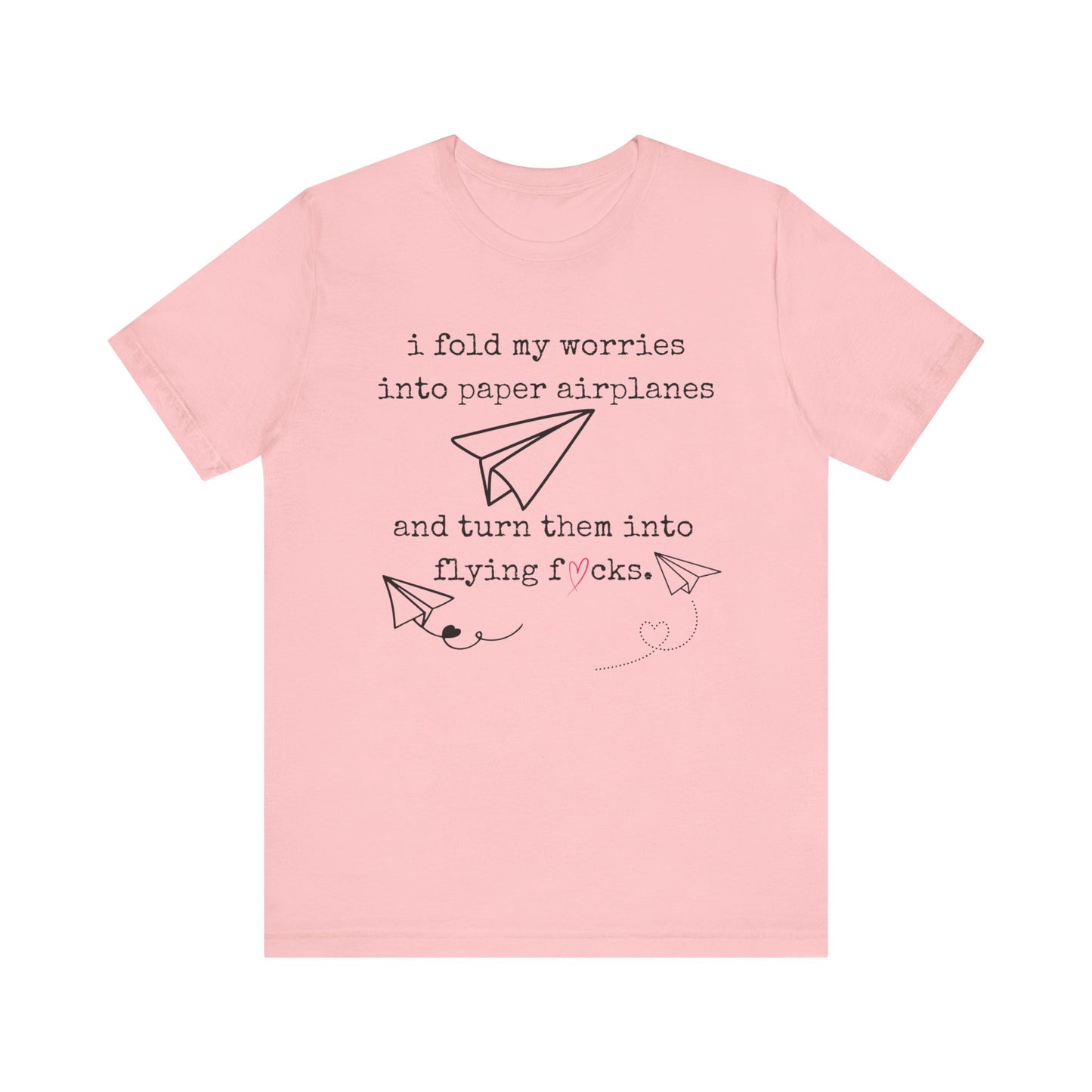 Women's adult humor t-shirt stating 'i fold my worries into paper airplanes and turn them into flying fucks' in color pink