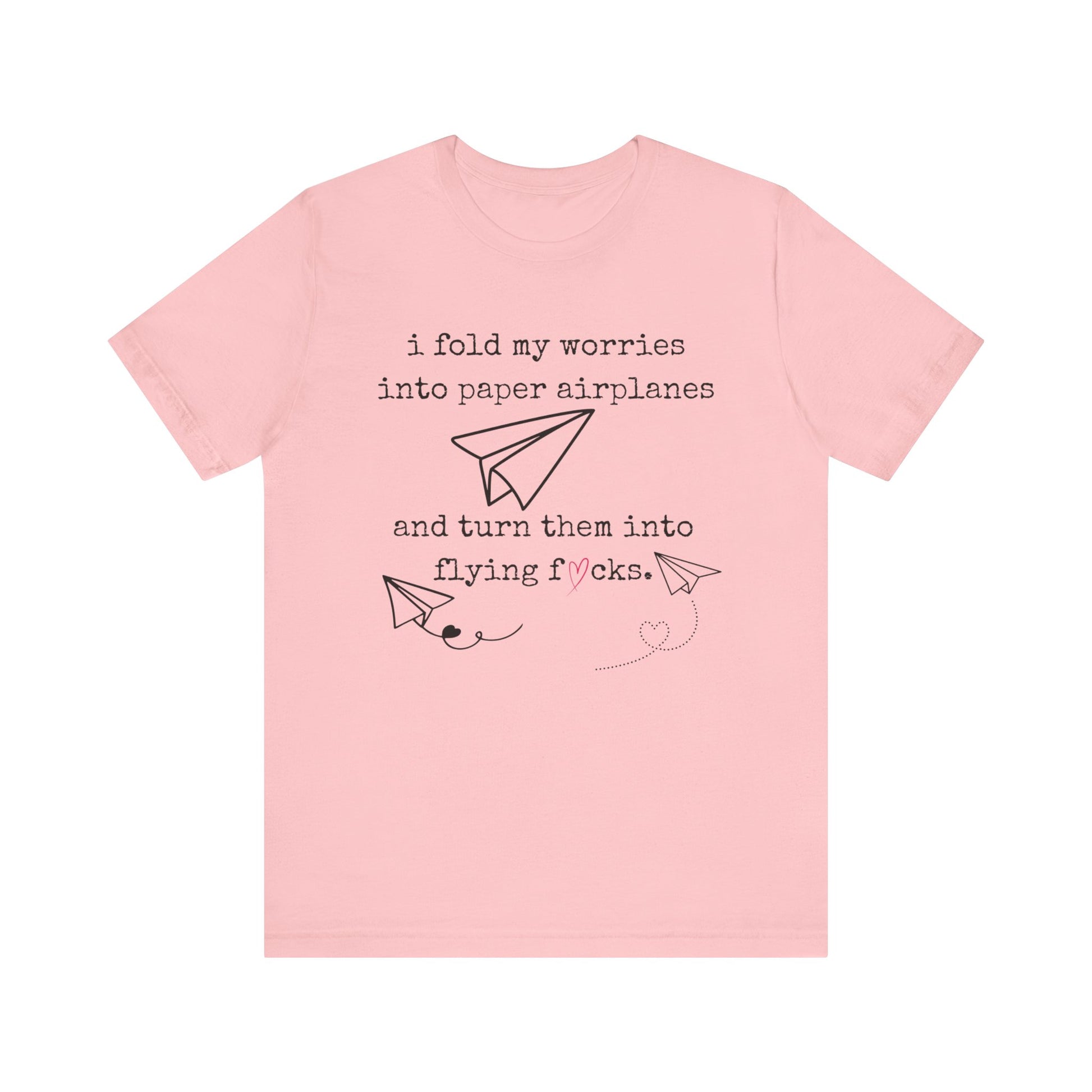Women's adult humor t-shirt stating 'i fold my worries into paper airplanes and turn them into flying fucks' in color pink