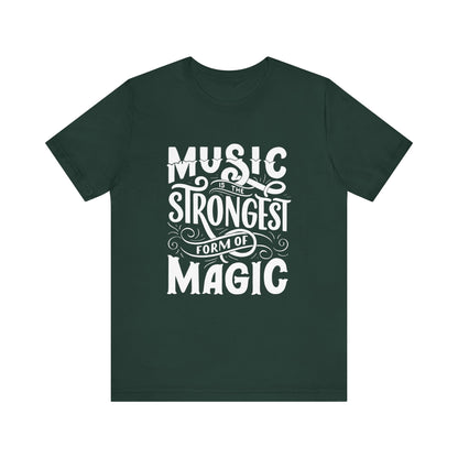 A comfortable good vibes tee stating 'Music is the strongest form of magic' in color forest