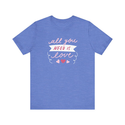 Comfortable Women's Graphic Tee Stating 'All You Need Is Love' in color heather columbia blue