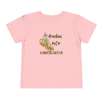 Comfortable toddler tee stating 'Buckin' into Kindergarten' in color pink