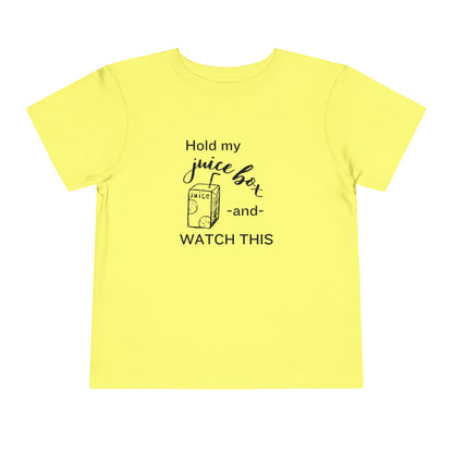 Comfortable funny graphic toddler tee stating 'Hold my juice box and watch this' in color yellow