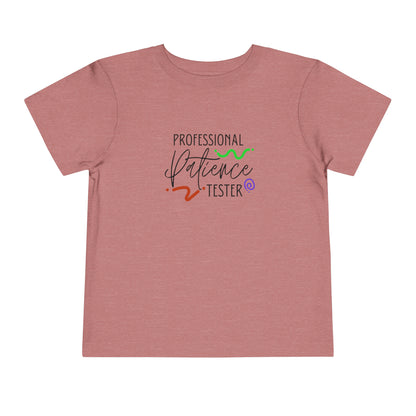 Comfortable funny graphic toddler tee stating 'Professional Patience Tester' in color  heather mauve