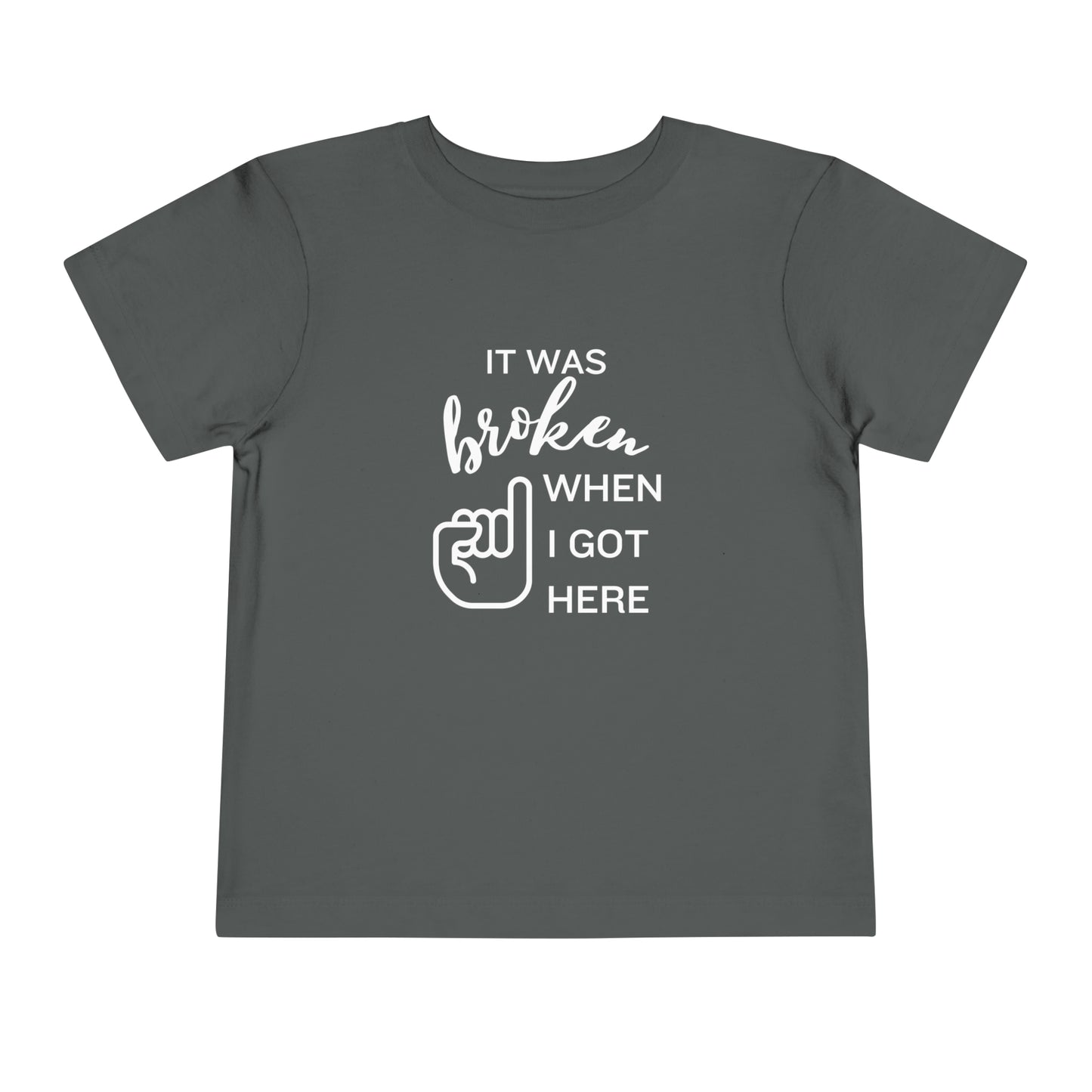 Comfortable funny graphic toddler tee stating 'It was broken when I got here' in color asphalt