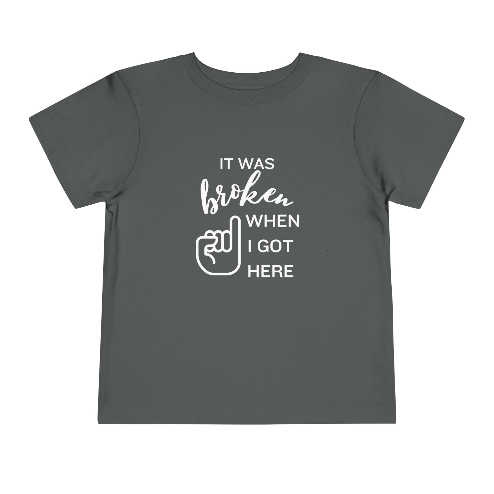 Comfortable funny graphic toddler tee stating 'It was broken when I got here' in color asphalt