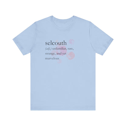 Comfortable women's good vibes tee that states 'selcouth (adj.) unfamiliar, rare, strange, and yet marvelous' in color light blue