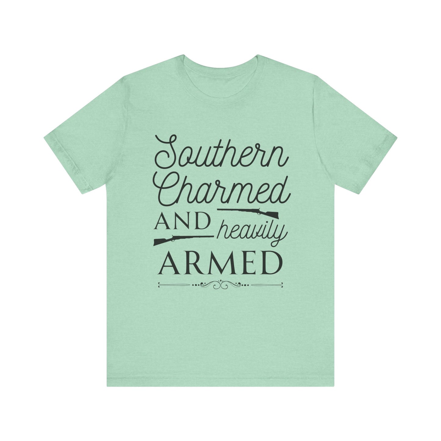 Adult unisex t-shirt stating 'Southern Charmed and Heavily Armed' in color mint heather