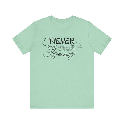 Good vibes women's tee stating 'Never Stop Dreaming' in color mint heather