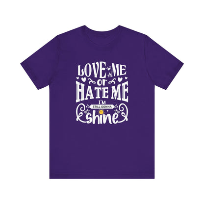 Women's good vibes graphic tee stating 'Love me or hate me, I'm still gonna shine' in color purple
