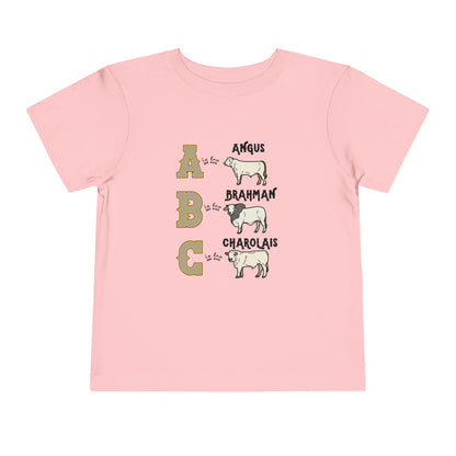 Comfy southern toddler tee stating 'A is for Angus. B is for Brahman. C is for Charolais.' in color pink