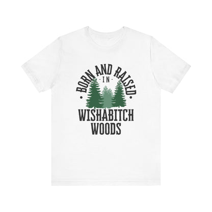 Comfortable adult humor tee stating Born and Raised in Wishab*tch Woods in color white