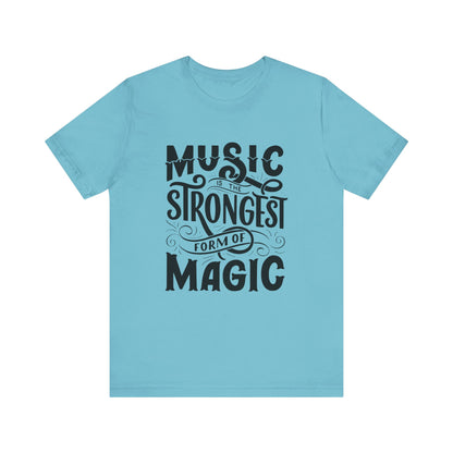 A comfortable good vibes tee stating 'Music is the strongest form of magic' in color turquoise
